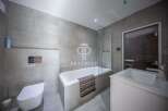Discover luxury living in this stunning property! Featuring a modern bathroom with sleek design and high-end finishes.