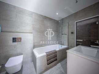 Discover luxury living in this stunning property! Featuring a modern bathroom with sleek design and high-end finishes.