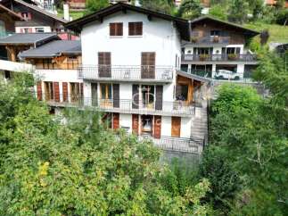 Discover a stunning property with multiple levels and charming balconies, perfect for enjoying scenic views.