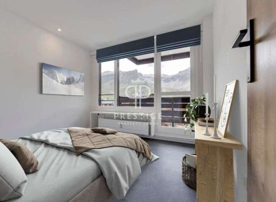 Experience breathtaking mountain views from this stunning bedroom.