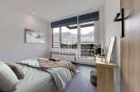 Experience breathtaking mountain views from this stunning bedroom.