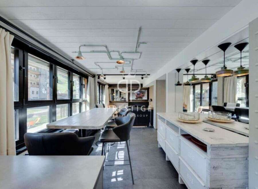 Experience luxury living in this stunning property, featuring a modern kitchen with sleek countertops and ample storage.