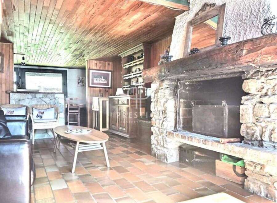 Cozy living room with a rustic fireplace, perfect for relaxing evenings.