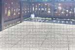 Discover a charming outdoor space with a unique wooden fence adorned with decorative cutouts.
