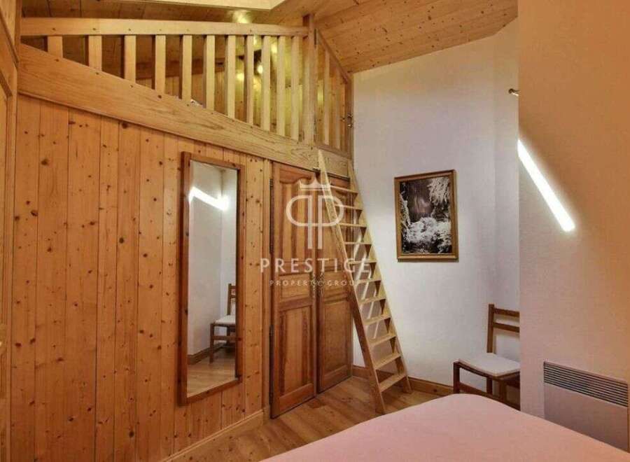 Discover the charm of this cozy wooden interior, perfect for a relaxing getaway.