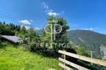 Discover a stunning property nestled in a picturesque mountain setting.