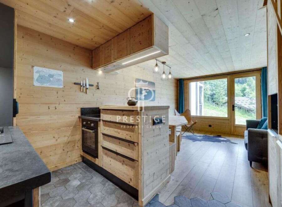 Discover the charm of this stunning property, featuring a beautifully designed kitchen with wooden accents and modern appliances.