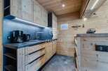 Discover the charm of this cozy kitchen, featuring beautiful wooden cabinetry and a modern design.