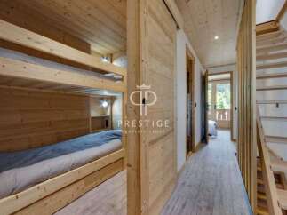 Discover the charm of this stunning property, featuring a cozy bunk bed setup perfect for family or guests.