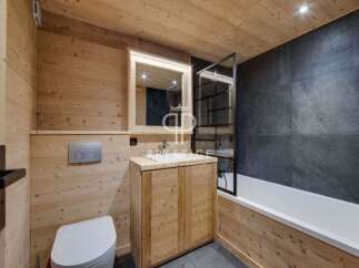Step into a beautifully designed bathroom featuring natural wood paneling that exudes warmth and rustic charm.
