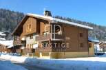 Discover a stunning chalet nestled in a picturesque winter wonderland.