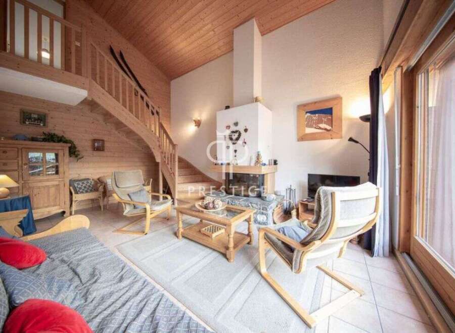 Discover the charm of this cozy chalet, featuring a stunning wooden interior and a welcoming fireplace.