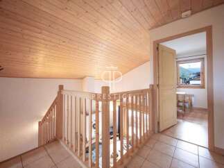 Discover the charm of this inviting property, featuring a beautifully crafted wooden ceiling that adds warmth and character.