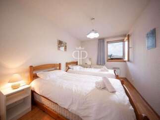 Discover a cozy bedroom with two comfortable beds, perfect for a relaxing stay.
