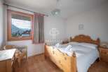 Discover a cozy bedroom with stunning mountain views.