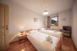 Cozy bedroom with two beds, perfect for a comfortable stay.