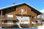 Discover the charm of this stunning wooden chalet, perfectly nestled in a picturesque mountain setting.