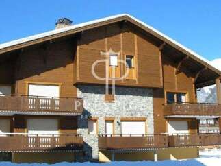 Discover the charm of this stunning wooden chalet, perfectly nestled in a picturesque mountain setting.