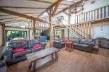 Experience rustic elegance in this stunning property, featuring exposed wooden beams and a unique architectural design.