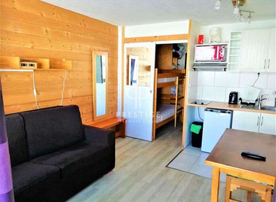 Cozy and compact living space, perfect for a small family or a couple.