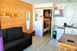 Cozy and compact living space, perfect for a small family or a couple.