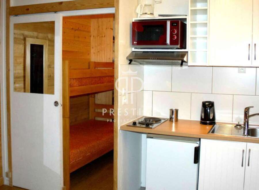 Discover a cozy retreat with this charming property, featuring a well-equipped kitchenette perfect for preparing meals.