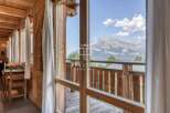 Experience breathtaking mountain views from this charming wooden chalet.