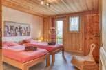 Discover a cozy bedroom with wooden accents and a charming ambiance.