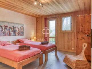 Discover a cozy bedroom with wooden accents and a charming ambiance.