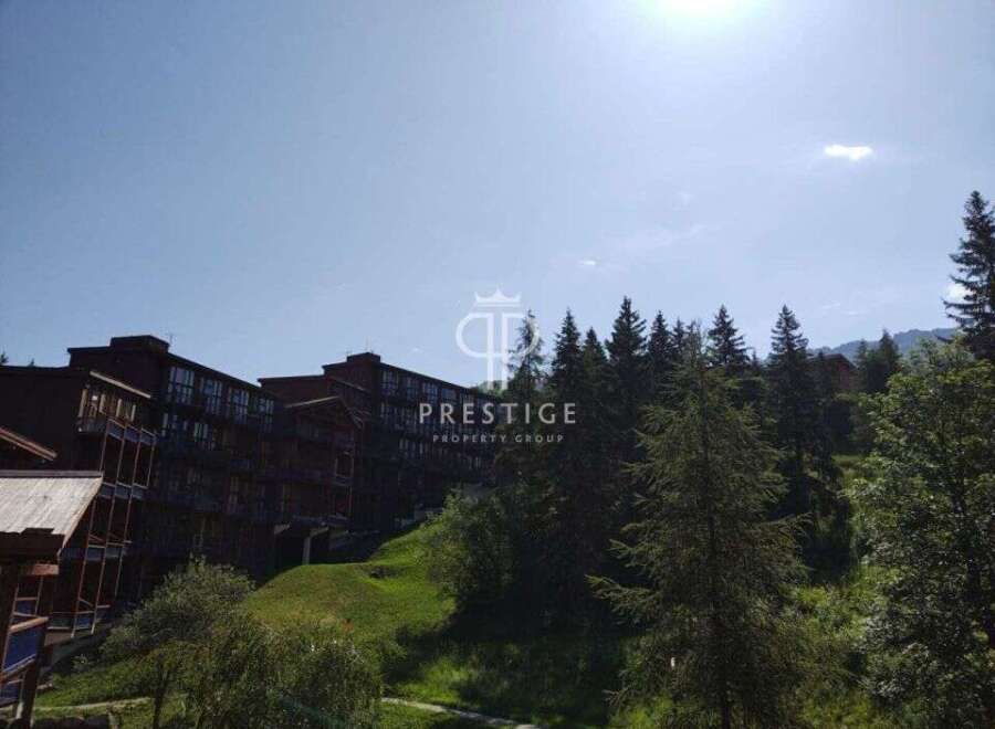 Discover a stunning property nestled amidst lush greenery and breathtaking mountain views.