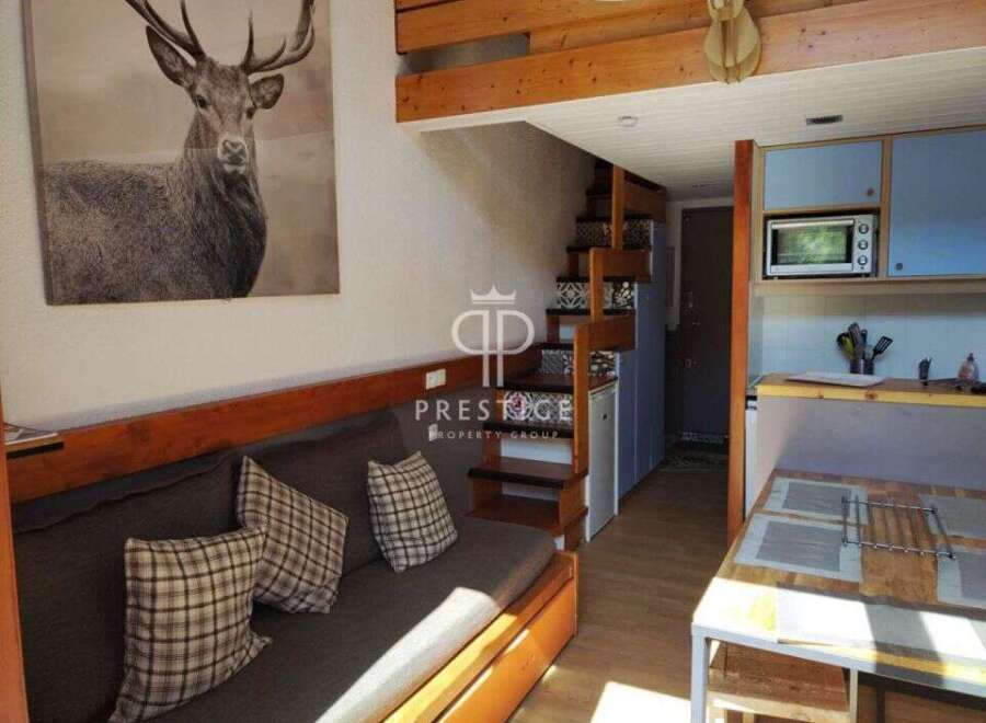 Discover this charming property featuring a cozy living space with a comfortable sofa and decorative pillows.