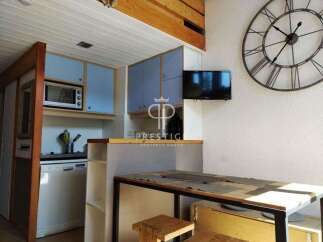 Discover this charming property featuring a well-equipped kitchen with modern appliances and stylish blue cabinetry.