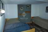 Cozy bedroom featuring two single beds, perfect for a comfortable stay.
