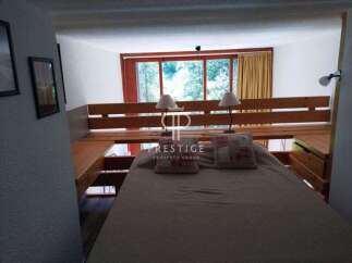 Discover a cozy bedroom with a unique loft bed design.