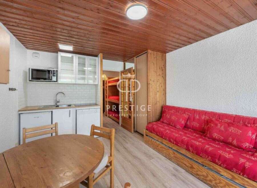 Cozy studio apartment with a well-equipped kitchenette, perfect for a comfortable stay.
