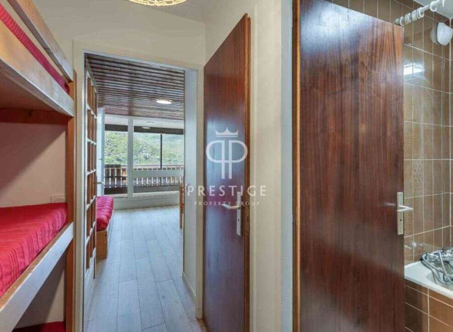 Discover a charming property featuring a cozy bunk bed setup, perfect for family or group stays.