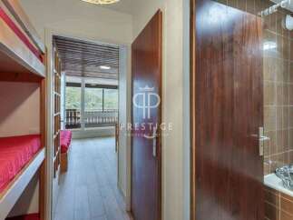 Discover a charming property featuring a cozy bunk bed setup, perfect for family or group stays.