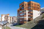 Discover a stunning property with a unique wooden facade, offering a blend of modern design and natural elements.