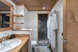 Discover a luxurious bathroom with a rustic wooden design.