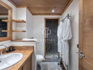 Discover a luxurious bathroom with a rustic wooden design.