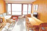 This cozy property features a bright and airy living space with large windows that offer stunning views.