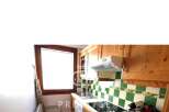 Discover this charming kitchen with wooden cabinets and a cozy atmosphere.