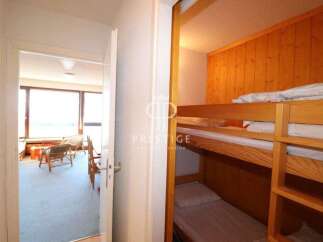 Discover a cozy retreat with this charming property, featuring a functional bunk bed setup perfect for maximizing space.