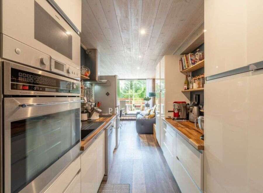 Discover a stunning kitchen with modern appliances and sleek design.
