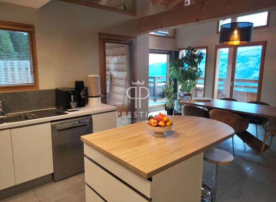 Experience luxury living in this stunning property, boasting a modern kitchen with sleek appliances and ample counter space.