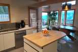 Experience luxury living in this stunning property, boasting a modern kitchen with sleek appliances and ample counter space.