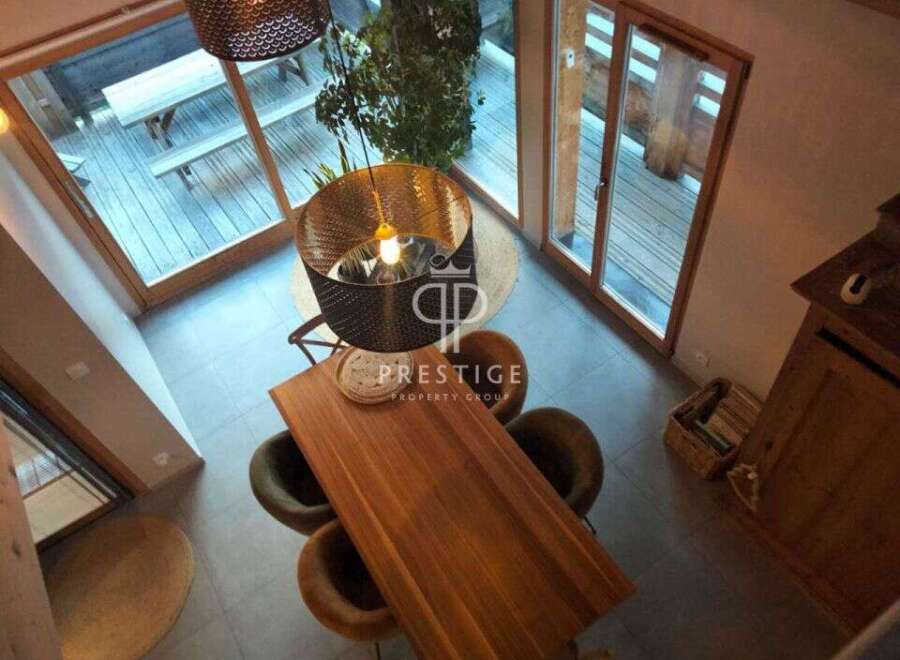 Discover a stunning property with a modern dining area, perfect for entertaining.