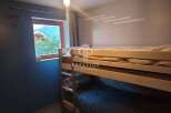 Cozy bunk beds offer a comfortable sleeping arrangement in this charming property.