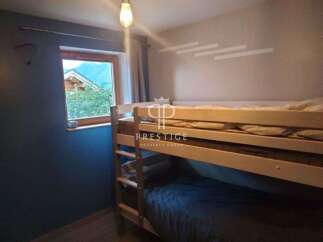 Cozy bunk beds offer a comfortable sleeping arrangement in this charming property.