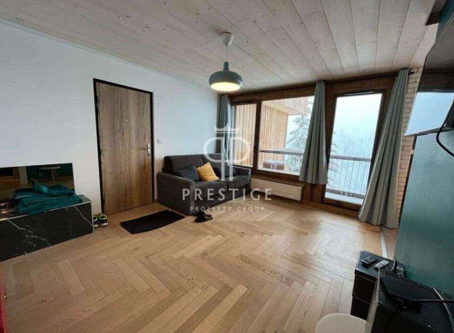 Discover a cozy living space with stunning wooden floors and a modern design.